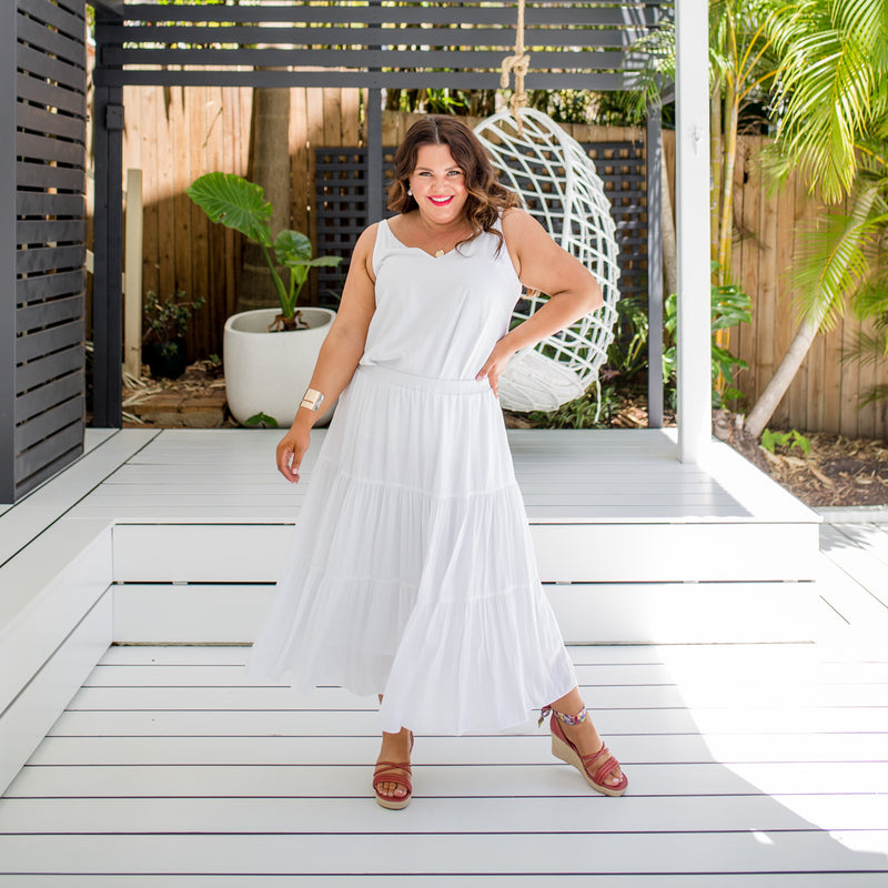Stace wearing our wearing our Sophie technical tiered maxi skirt in white with Rachael technical cami in white 