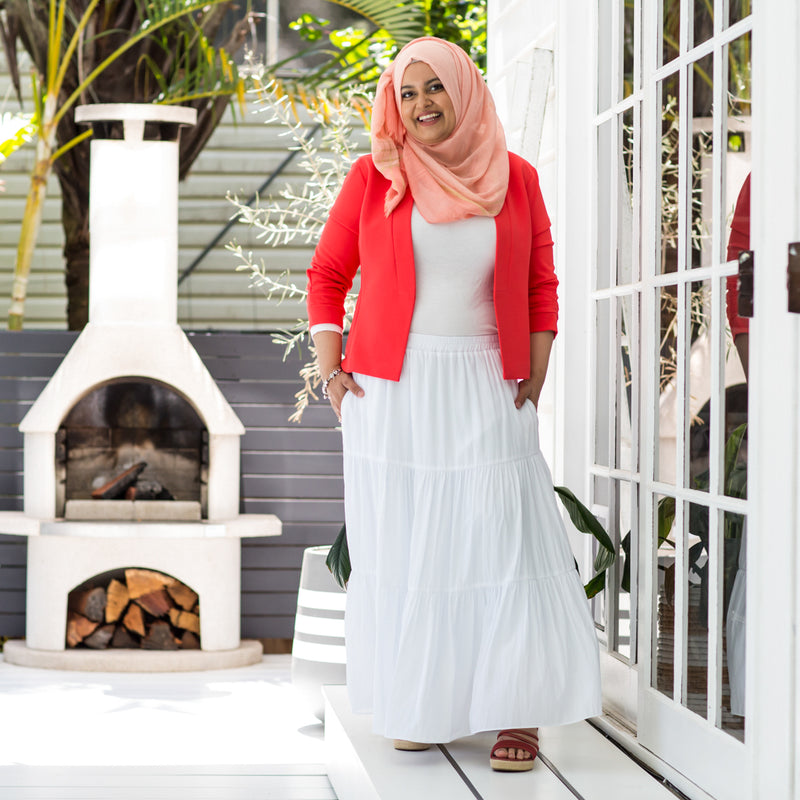 Faaiza wearing our Sophie tiered technical skirt with our Coral Hjiab and Coral Karen scuba jacket. 